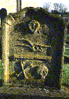 Gravestone with Emblems (8990 bytes)